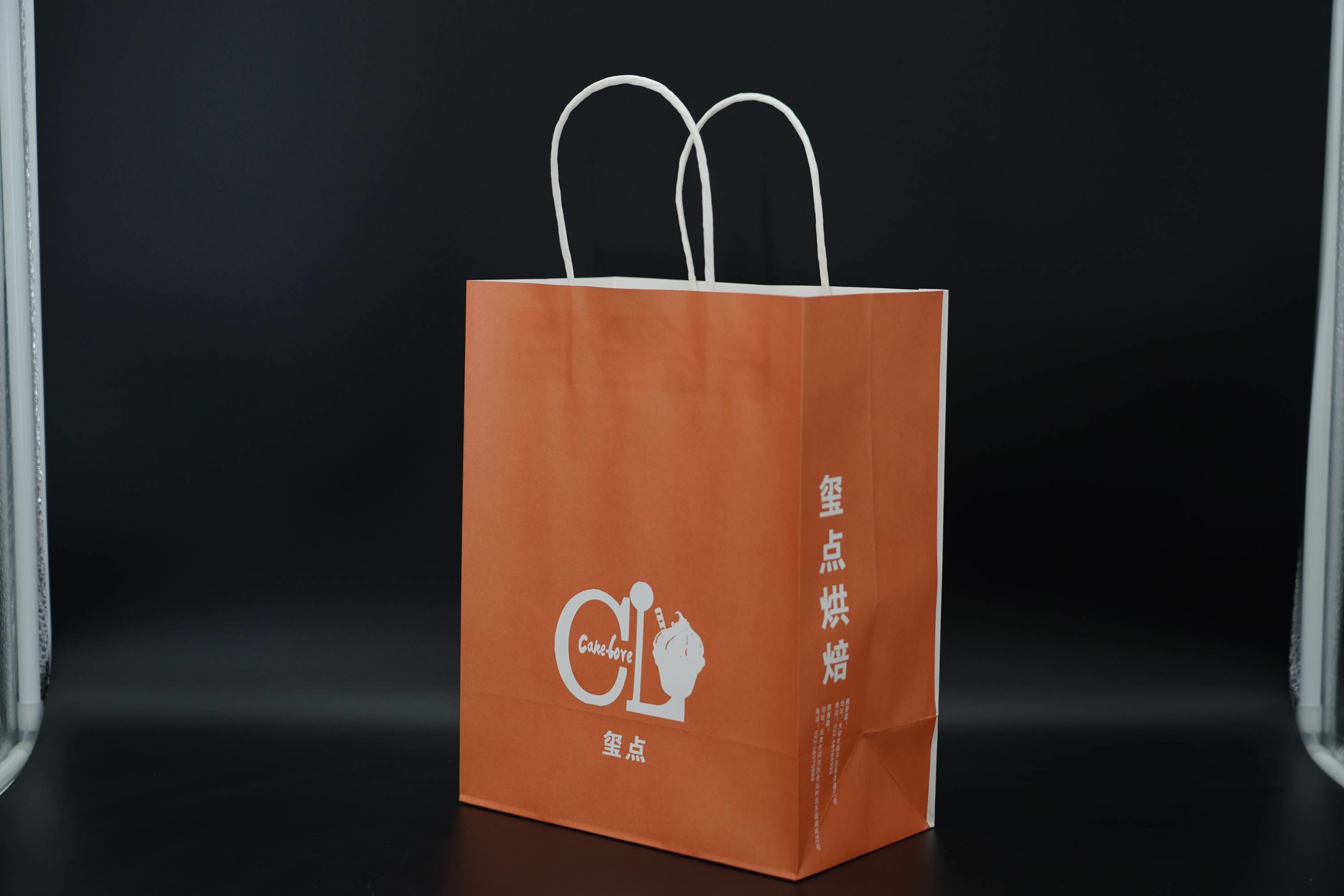 Custom Orange Eco Paper Bags With Handles Twisted Solid Plate Printing