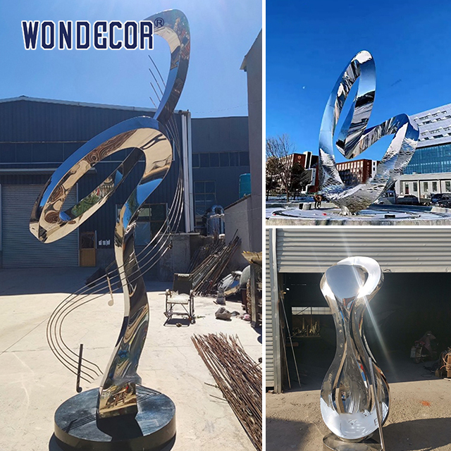 Large rotating stainless steel sculpture outdoor square park