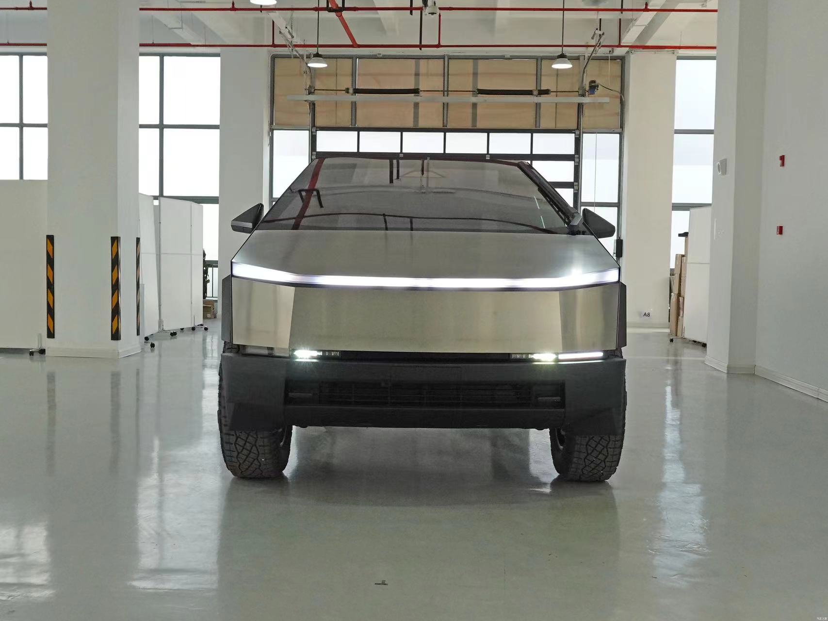 Silver Tesla Cyber Off-Road Pickup Truck with All Steel Body and 180 Km/h Max Speed