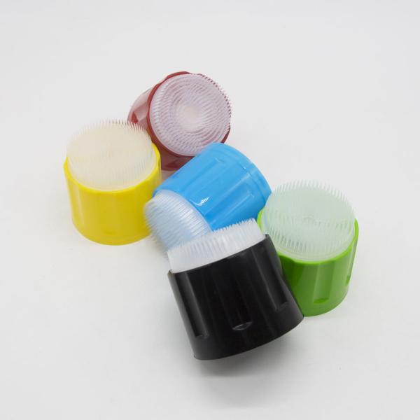 Aerosol scrubbing brush cap in use on car wheel