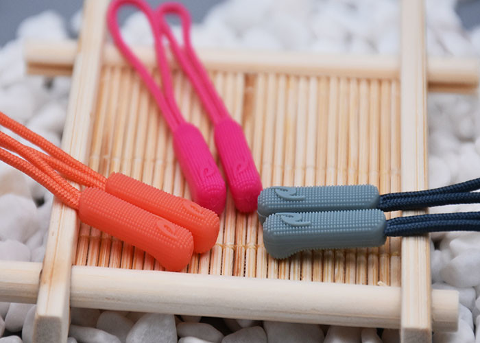 3D Embossed Plastic Zipper Puller With Polyester String For Garments