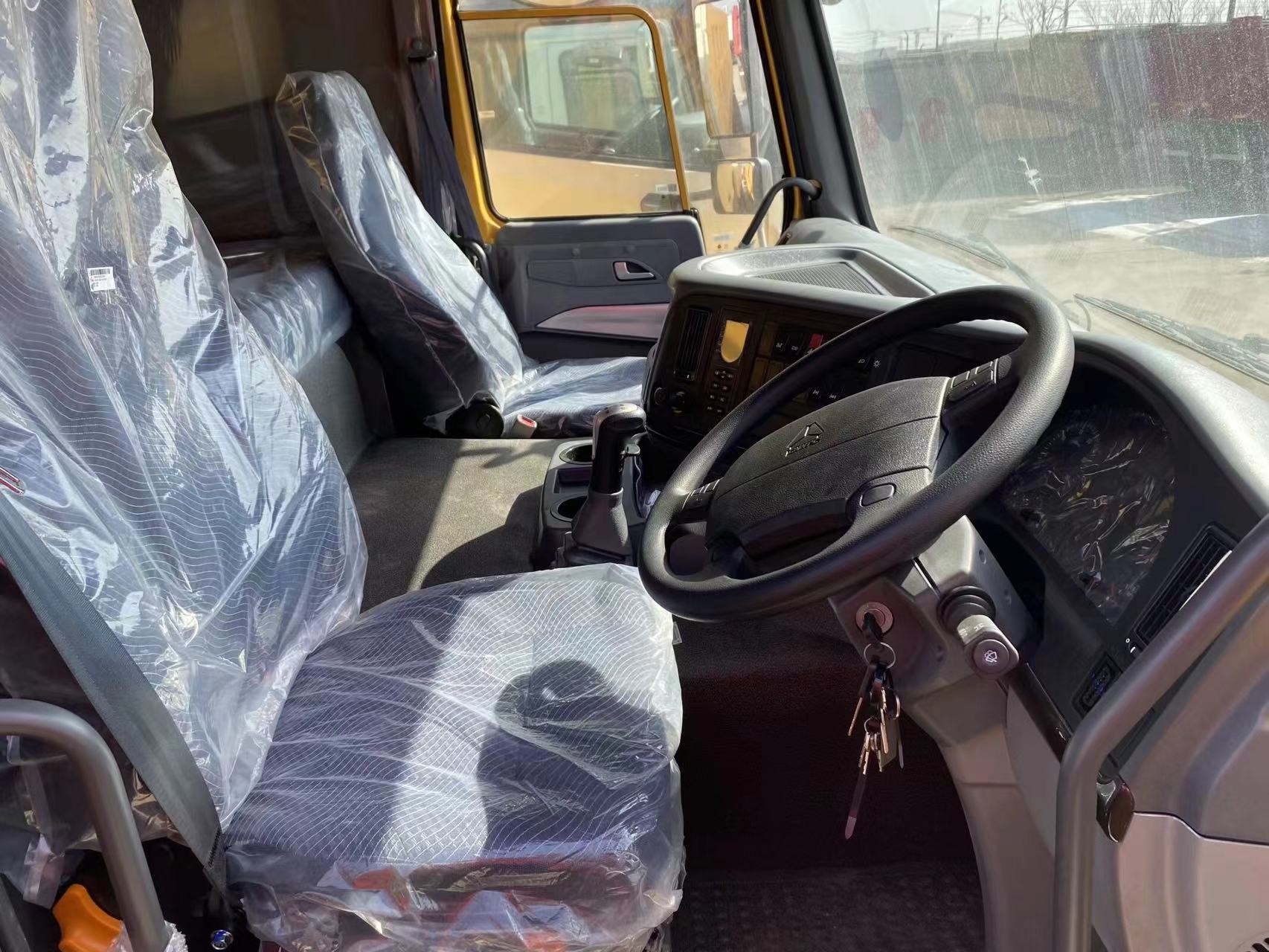 Howo Sino Truck 2023 Yellow Color 6*4 Drive Mode Weichai 380hp Right Hand Drive Brand New