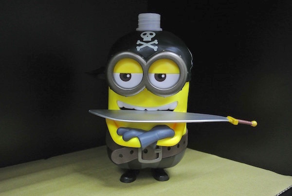 Yellow Color Cartoon Shampoo Bottle Have Sword With Universal Studios Logo