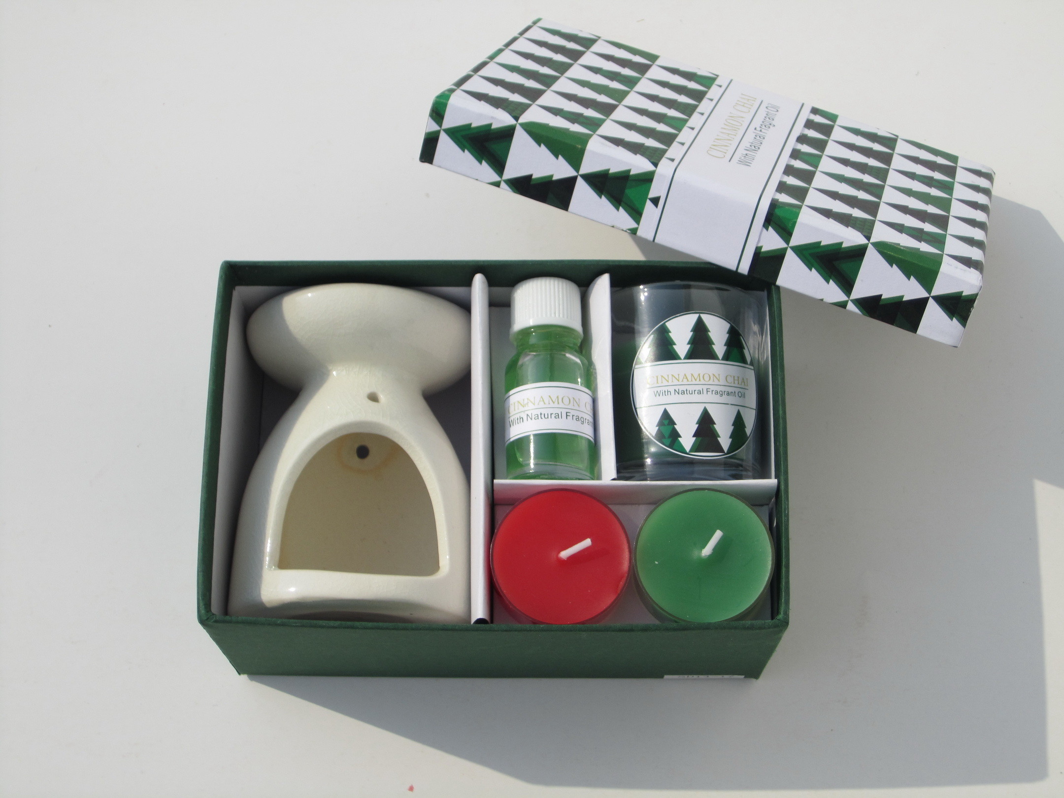 Red & Green Cinnamon chai fragrance scented tealight candle & essential oil with printed label packed into gift box