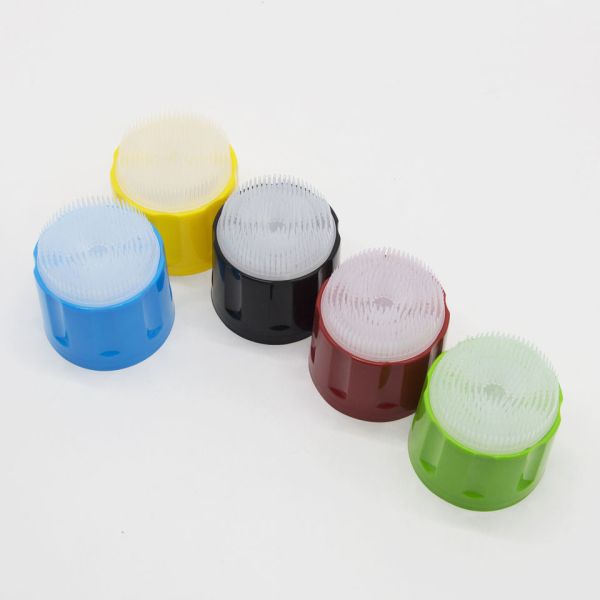 Brush cap attached to foam cleaner bottle