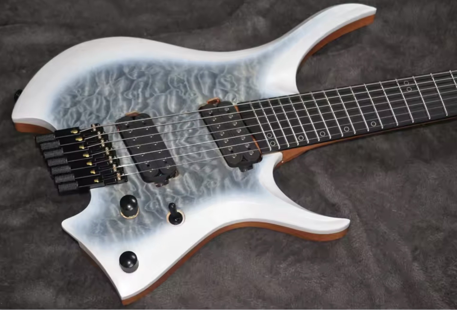 2025 Fanned Frets 7 Strings Headless Electric Guitar White Color with Eye Poplar 5-ply Roasted Maple