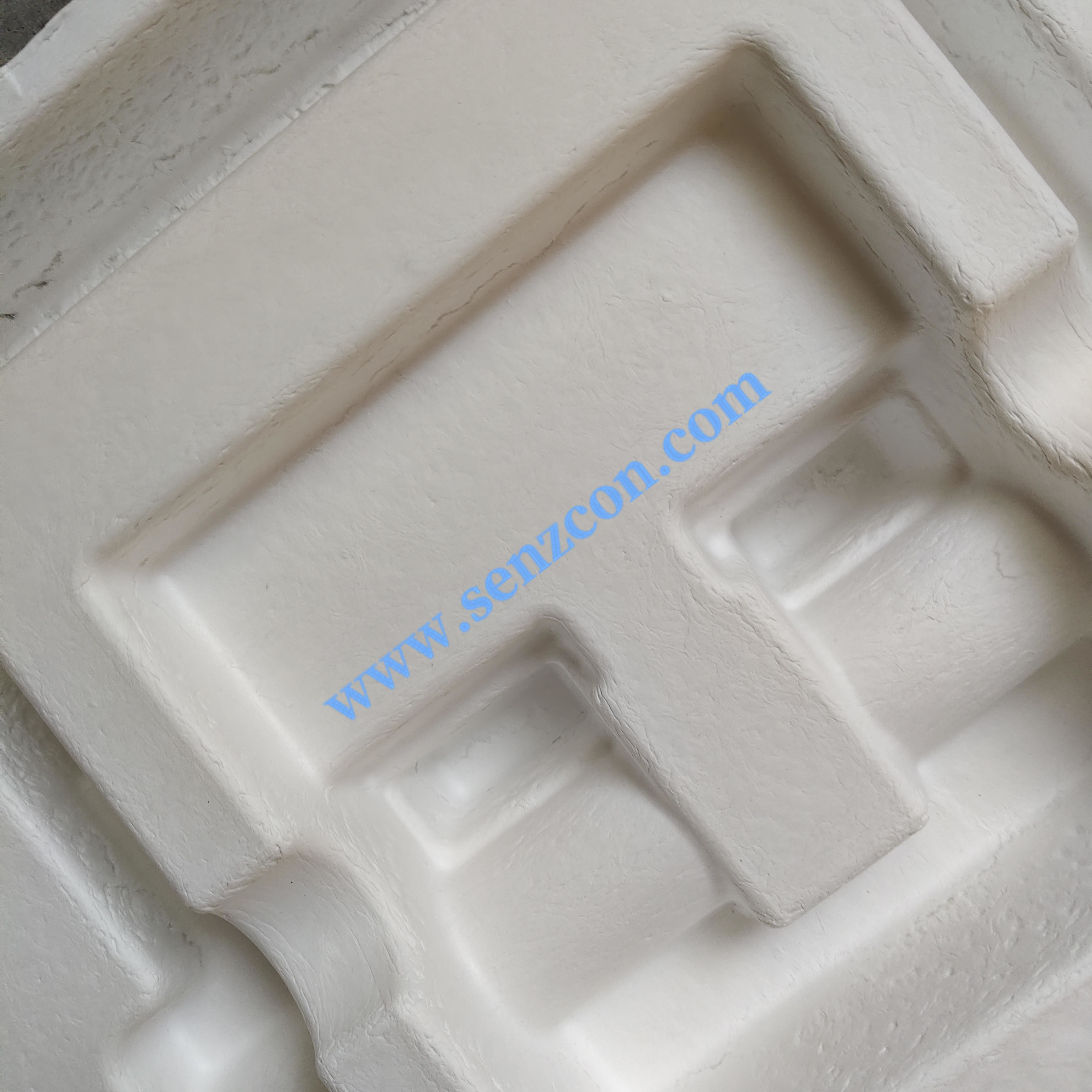 The dry-pressed pulp molded packaging made of white sugarcane pulp, which is customized by the manufacturer for fitness equipment.