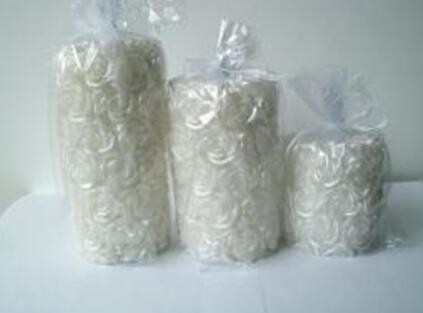 Red & Pearl scented pillar candle wrapped by lots of rose packed into gift bag
