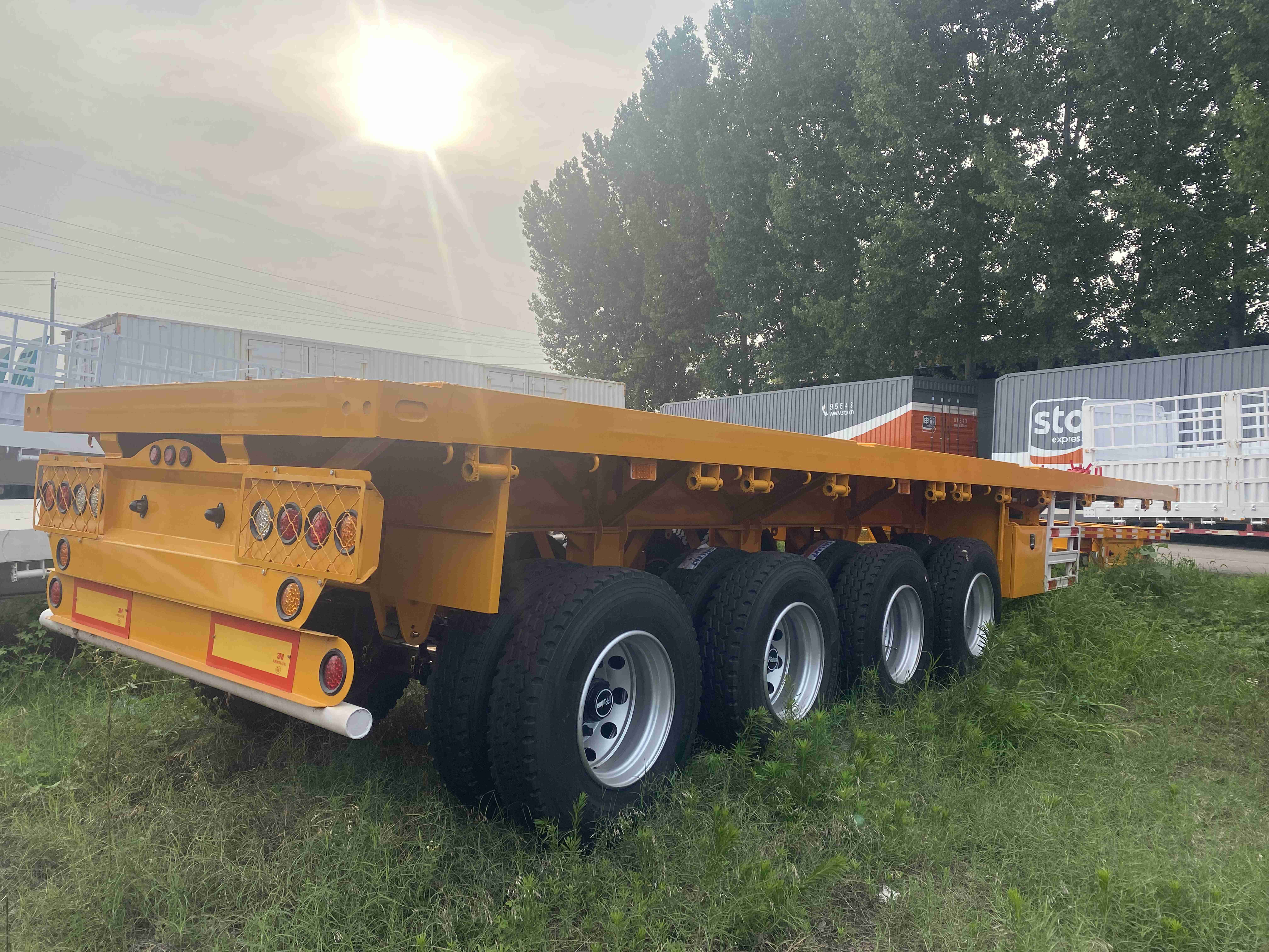 Best Price 40T-100T Flatbed Low Bed Semi Trailer 3-Axle Skeletal Semi-Trailer for Container Transport