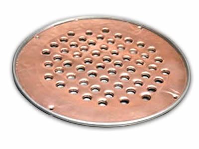 There is a copper perforated filter disc with round holes.