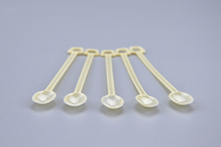 The disposable coffee soup with small spoon coffee stir bar muddler yellow