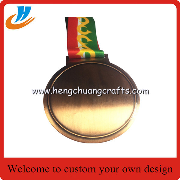 Polished gold Olympic games medals with ribbon, Olympics trophy and award medals