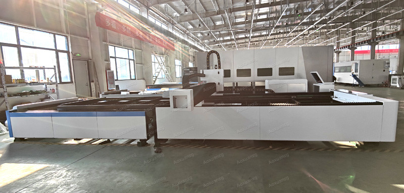 Open Type 3015 Three Chuck Tube And Plate Fiber Laser Cutting Machine 3000w CNC Laser Cutter With Exchange Platform