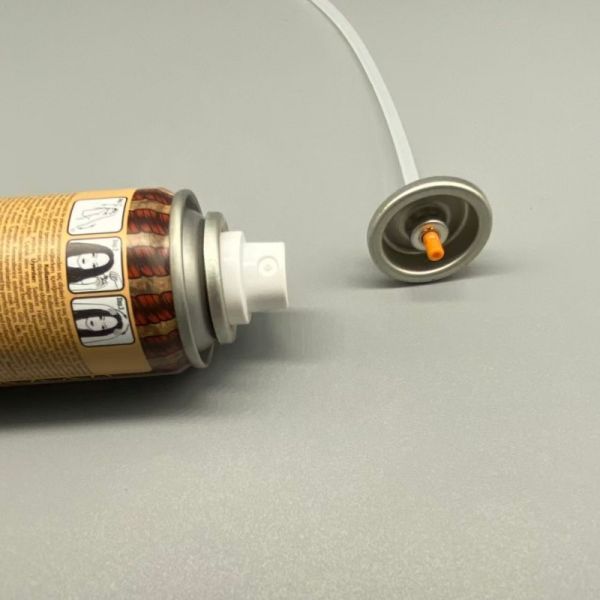 Dry shampoo aerosol valve component close-up view