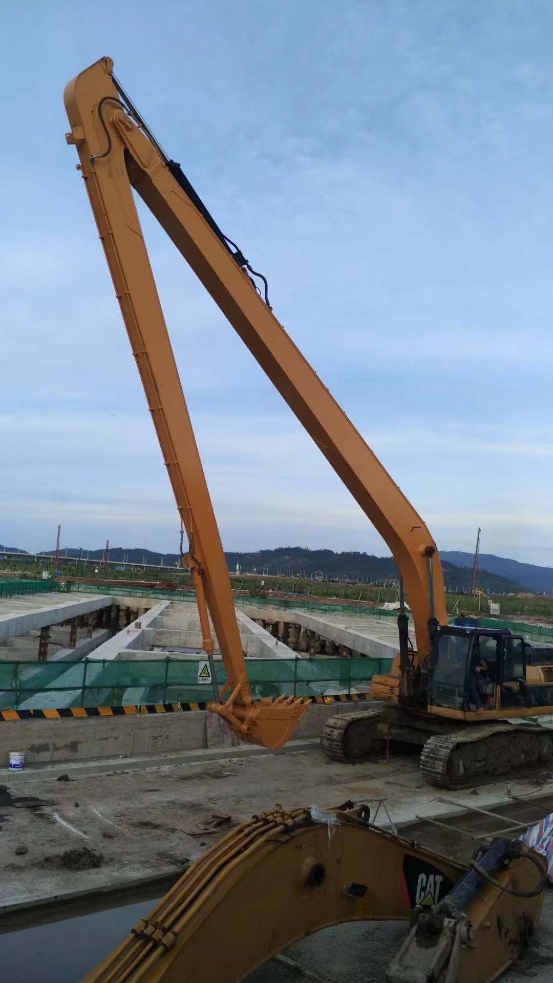 Excavator extension arm and port dredging designed for river dredging