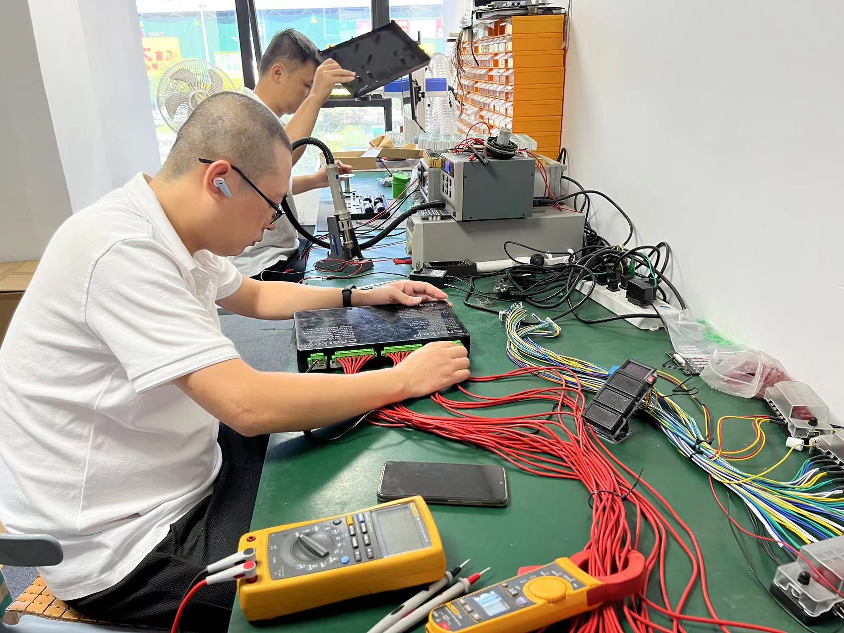 Enerkey engineer is testing enegy storage smart bms for solar panel