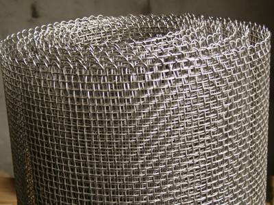 A roll of 304 stainless steel screen on the ground with wrapped edge.