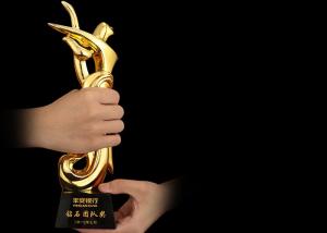 China Poly Resin Material Award Cups Trophies With Abstract Figure Design on sale