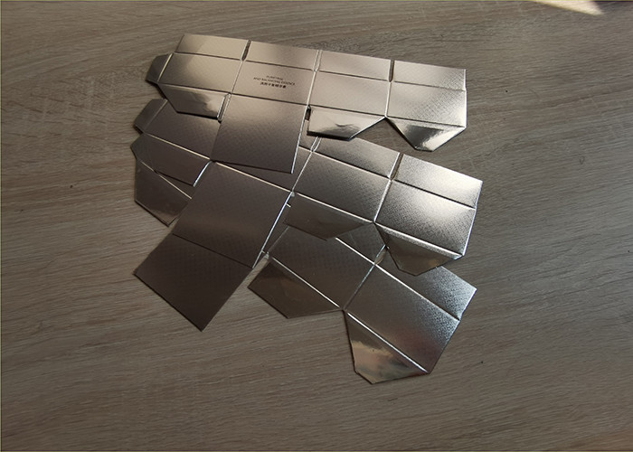 Factory supplying customized silver paper cosmetics essence packaging boxes