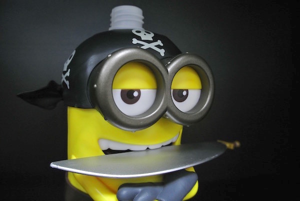 Yellow Color Cartoon Shampoo Bottle Have Sword With Universal Studios Logo