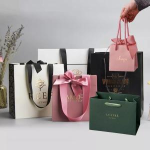China Grosgrain Handle Matte Black Paper Bag Gold Hot Stamping Retail Paper Shopping Bag on sale