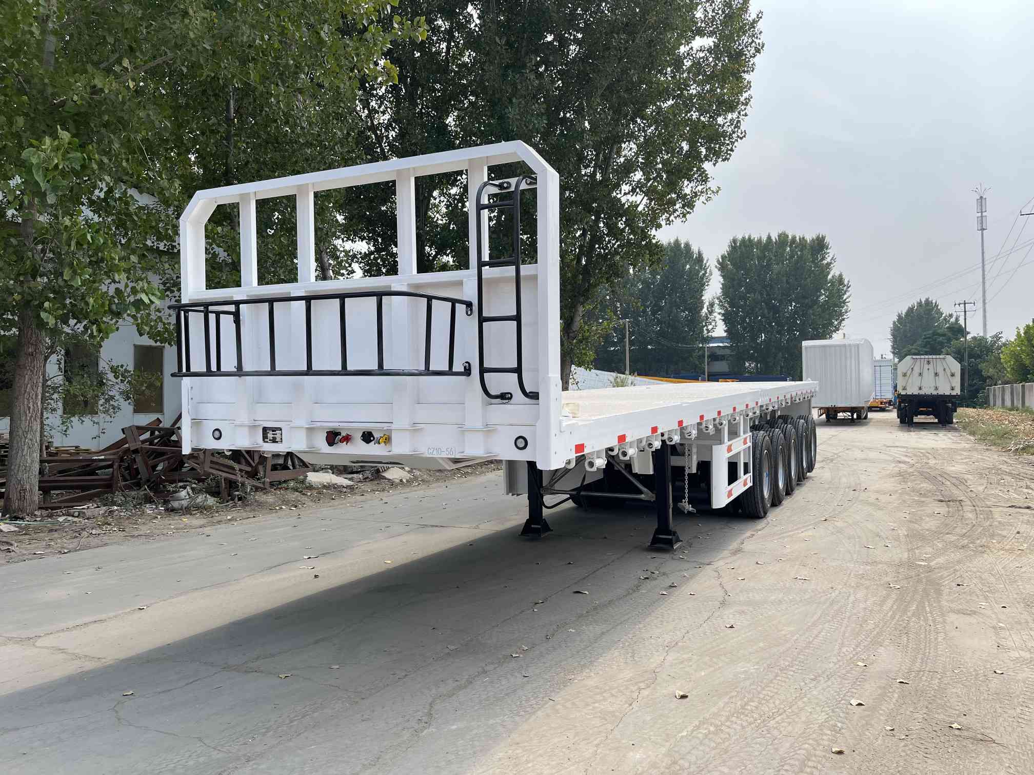CIMC cheap 3 axles high Steel Cargo Hot Sale 20ft 40ft Container Chassis with lock Low Flat Deck transport Flatbed Semi Trailer