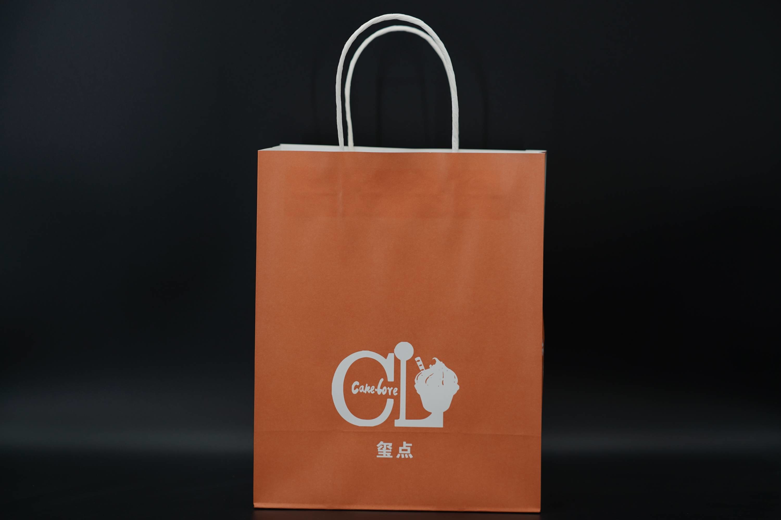 Custom Orange Eco Paper Bags With Handles Twisted Solid Plate Printing
