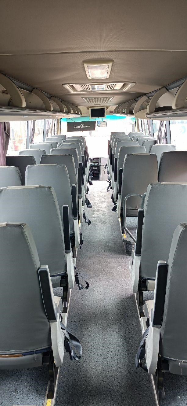 Used Tour Bus For Africa Used Golden Dragon Bus Yuchai Rear Engine 233kw 53seats Euro IV Airbag Chassis Low Kilometer
