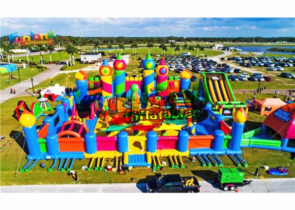 Quality Giant Outdoor Rainbow Castle Theme 1500W Inflatable Fun Land for sale