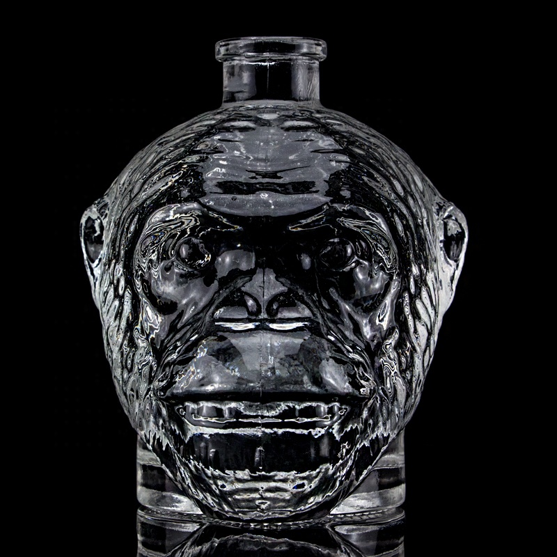 Customized Surface Handing Football Shaped Glass Bottle for Unique Alcohol Beverage