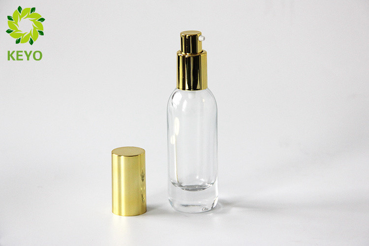 Clear Glass Foundation Bottle 30ml Thick Bottom Type With Gold Aluminium Pump