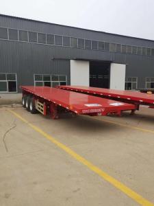 China New Tri-Axle  40 Tons  Foot Container Chassis Flatbed Semi Trucks Trailer on sale