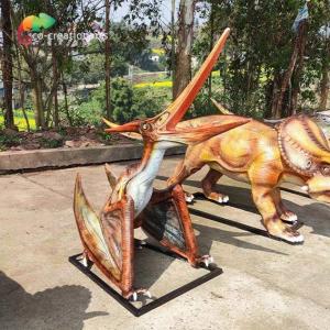 China 220vac 3D Fiberglass Realistic Looking Dinosaurs Struggled Pterosauria Statue Outdoor on sale