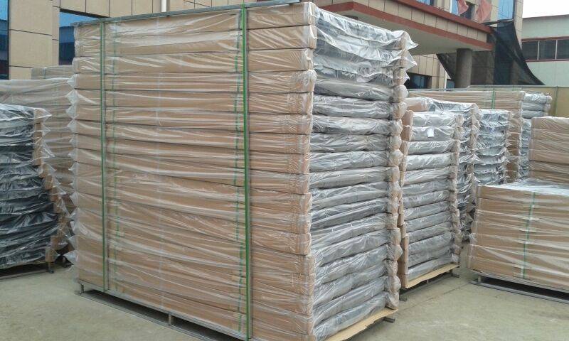 Paladin fence panels were protected by cardboard, plastic film and were put on pallets, waiting for delivery in the gate.