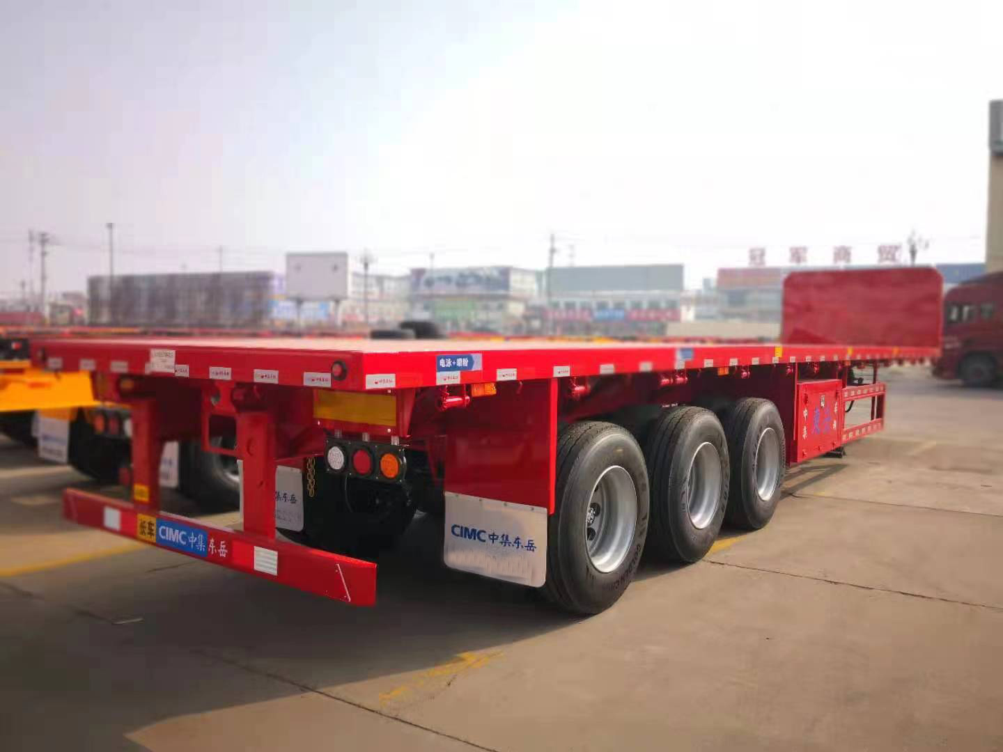 CIMC cheap 3 axles high Steel Cargo Hot Sale 20ft 40ft Container Chassis with lock Low Flat Deck transport Flatbed Semi Trailer