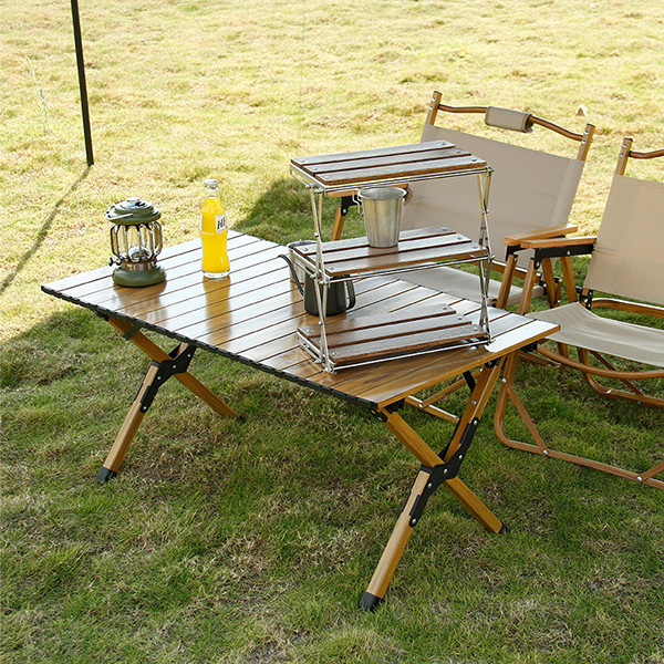 Close-up of folded camping table with carrying bag