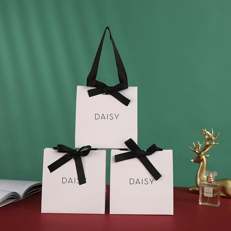 Embossing Ribbon Handle Cosmetic Paper Bags White Paper Carrier Bags