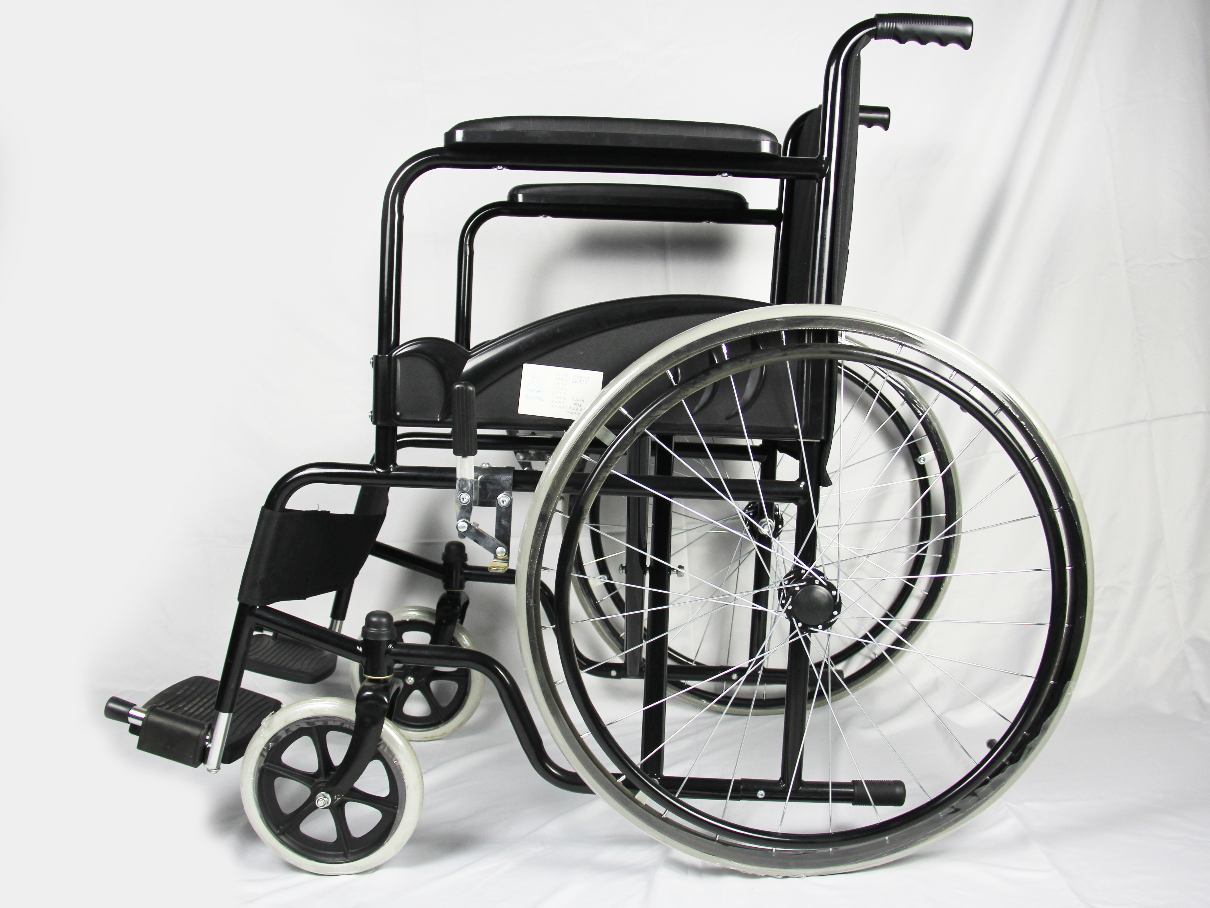 Low Price Basis Black Coating Steel Frame Folding Steel Wheelchair With Solid Wheel Fixed Armrest And Footrest