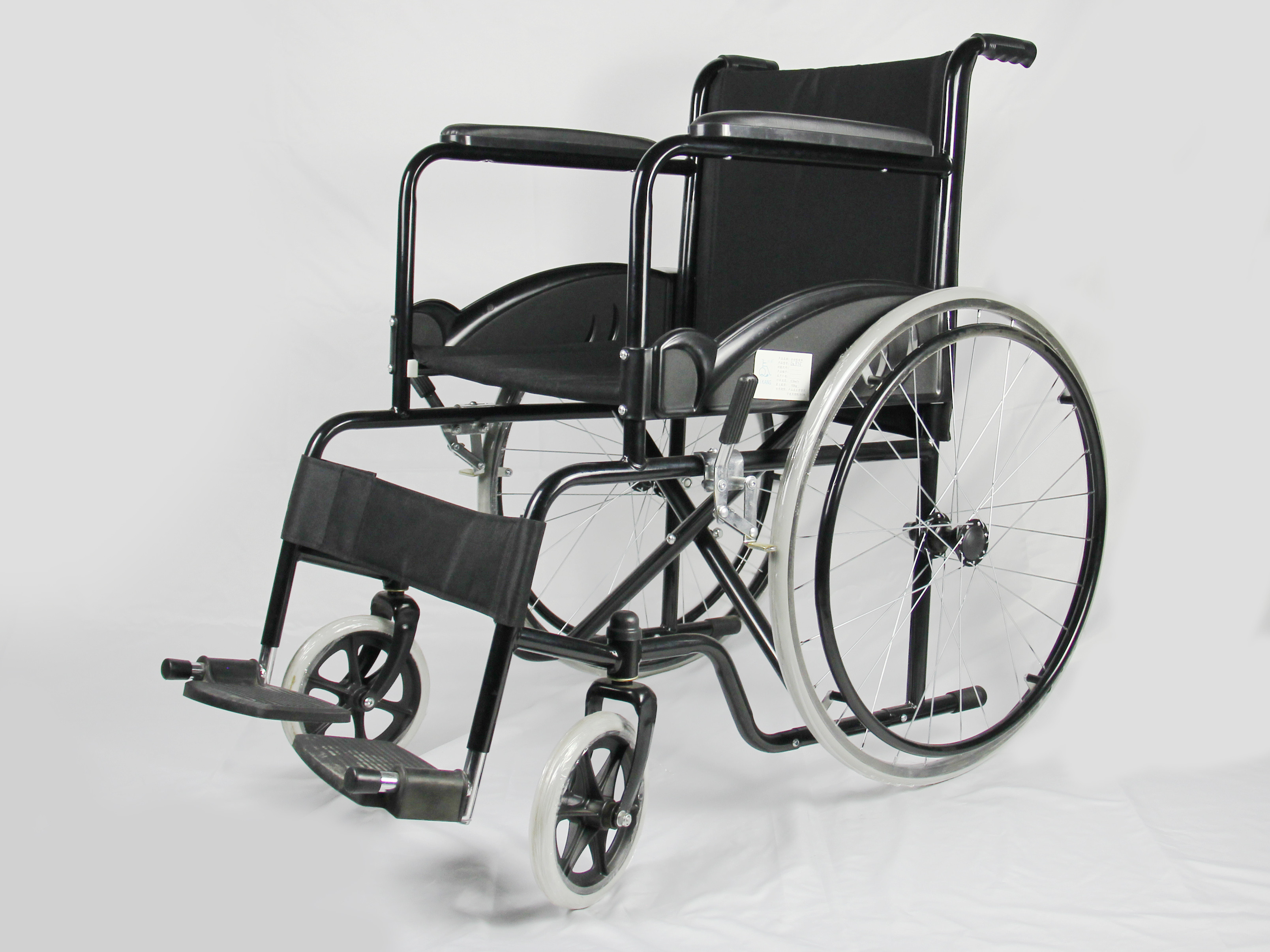 Low Price Basis Black Coating Steel Frame Folding Steel Wheelchair With Solid Wheel Fixed Armrest And Footrest