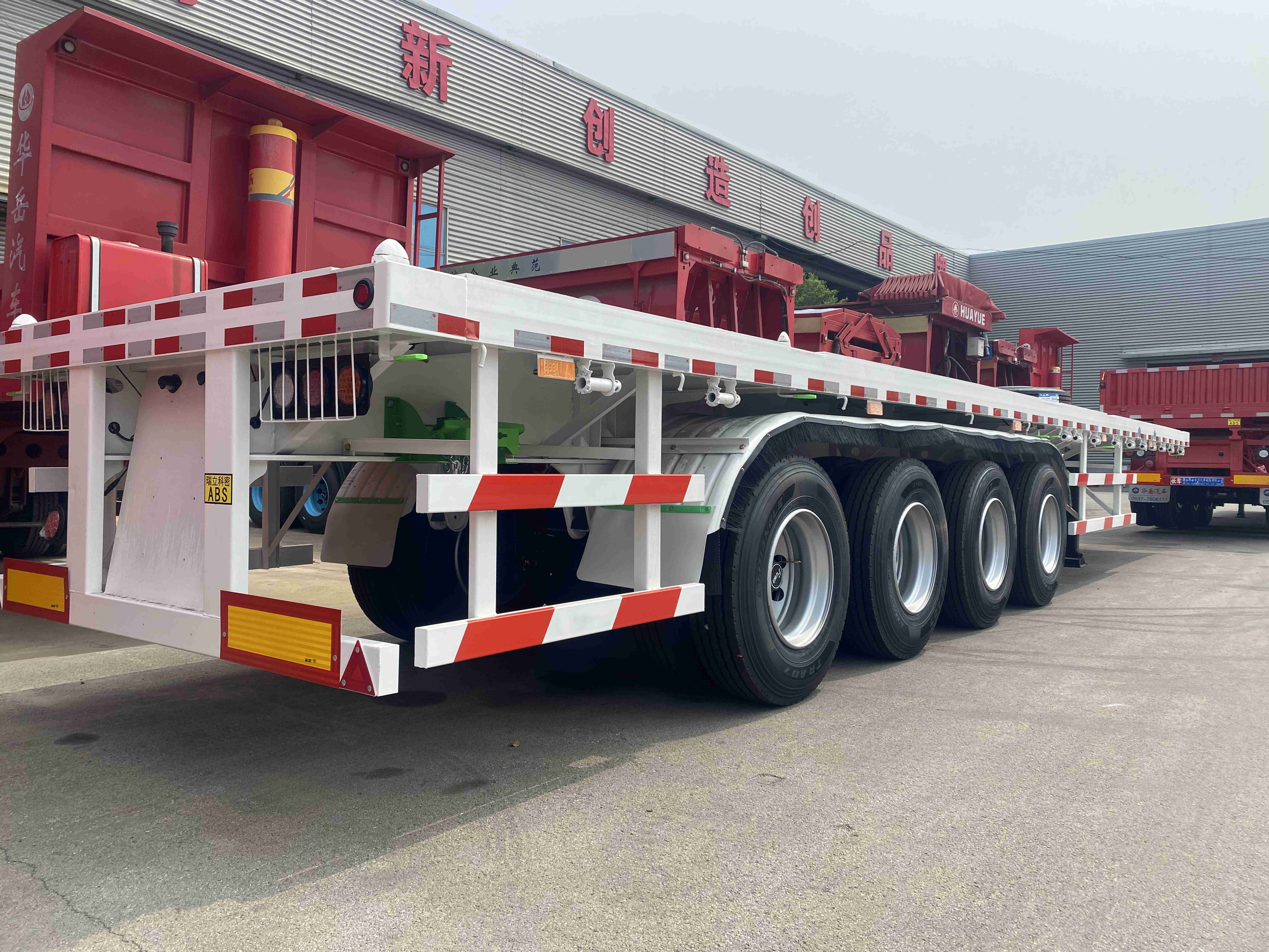 30 40 50 Ton 2 3 4 Axles Flatbed Semi Truck Container Trailer 48 Ft 40 Ft 20 Ft Flatbed Trailer for Sale