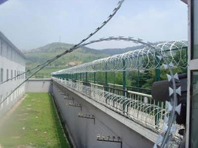 Concertina razor wires are installed outside of the factory.