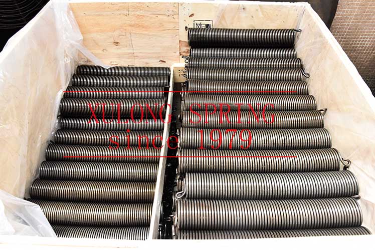 Garage door torsion springs packed with wood carton