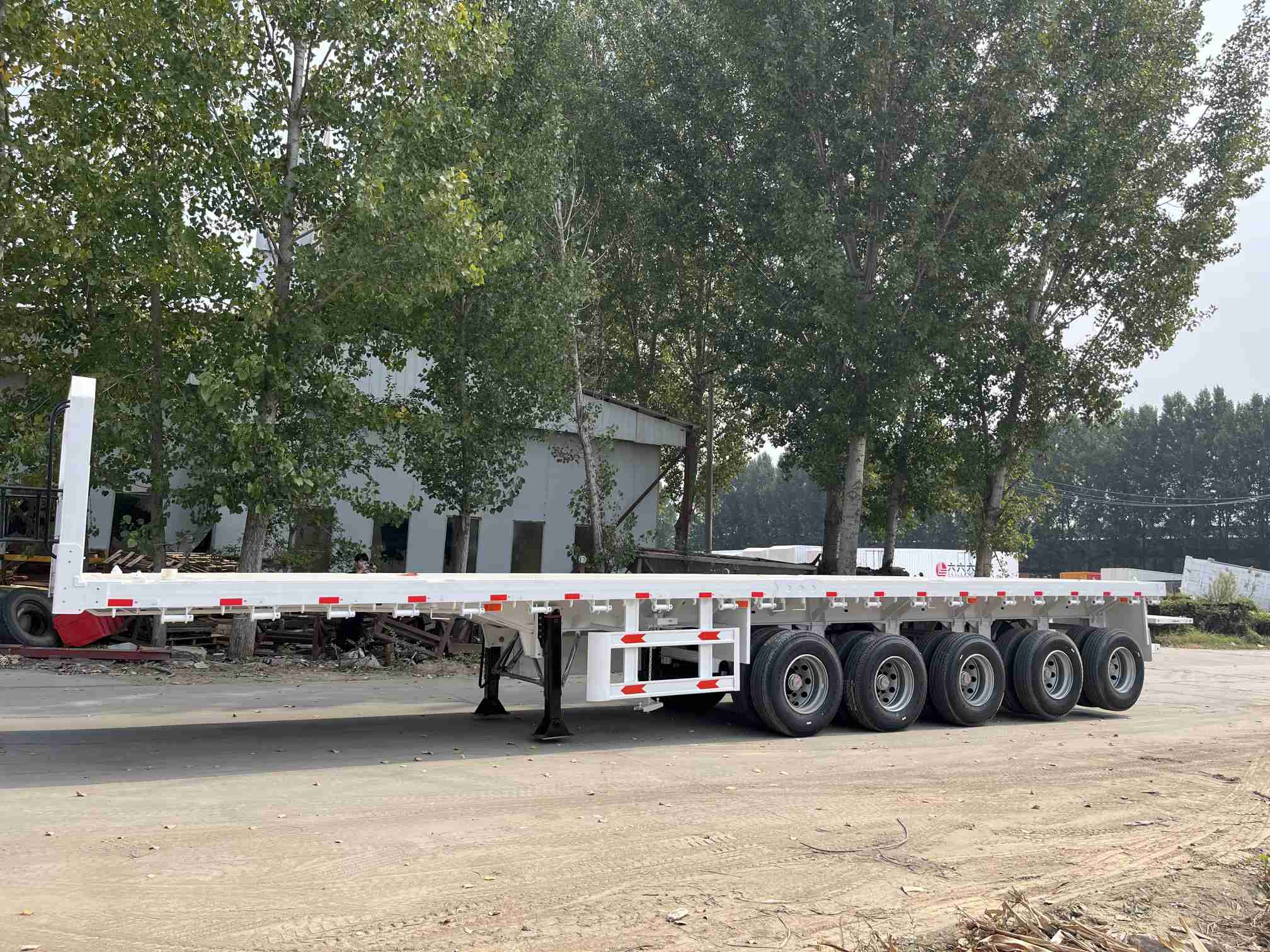 CIMC cheap 3 axles high Steel Cargo Hot Sale 20ft 40ft Container Chassis with lock Low Flat Deck transport Flatbed Semi Trailer