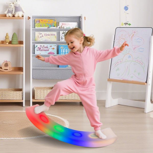 Multiple children using balance boards together in a play setting
