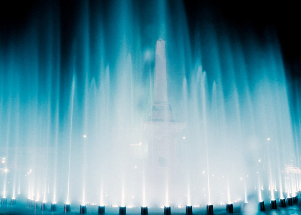 large music dancing water fountain on the water surface