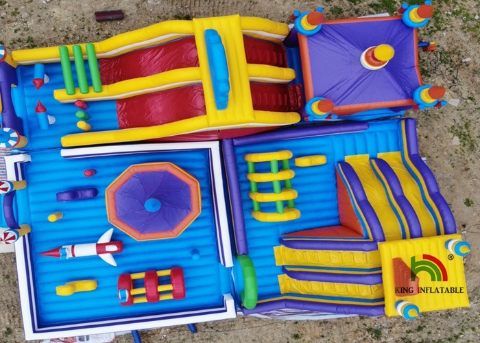 Outdoor 20mL Yellow Rocket Inflatable Amusement Park For Kids Use Logo Printing