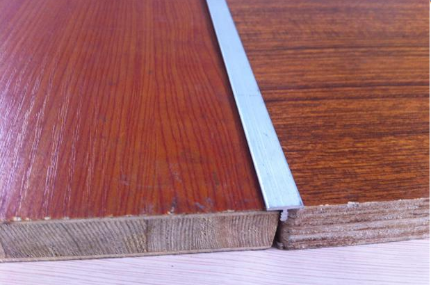 polished silver T shaped profile for the floor
