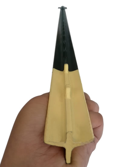 A hand is holding a piece of green color studded T post.