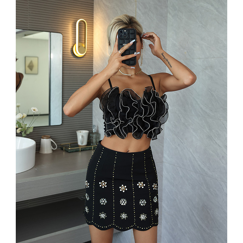 Effortlessly Flirty: Ruffled Backless Tube Top and Mini Skirt ruffled backless tube top paired with a flirty mini skirt