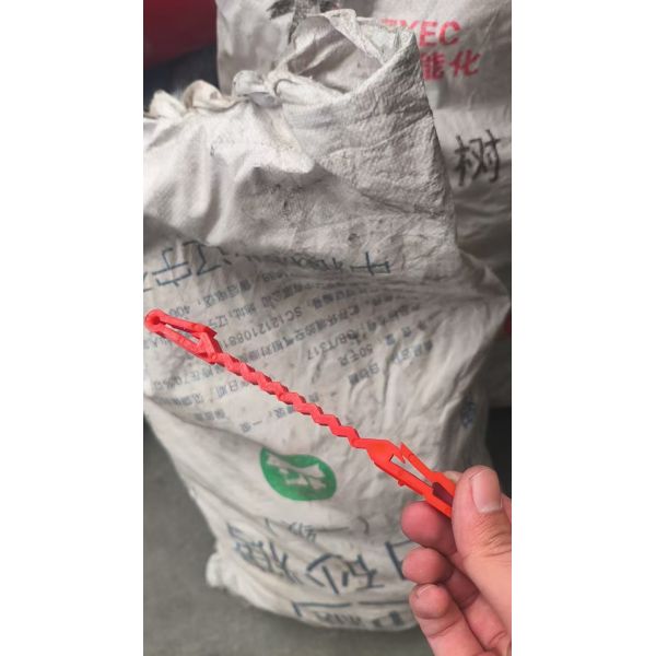 Red Plastic Support Clips That Go Between The Concertina Wire And The Wire